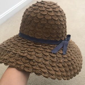 adjustable floppy straw hat with blue ribbon